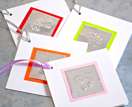 Mini folded Gift Cards for all occasions , embellished with decorative imprinted aluminum with accented colored card stock, ribbon for tying